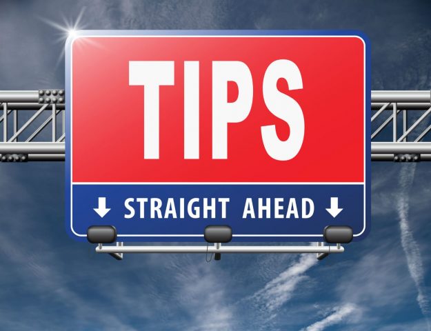 tips straight ahead red blue road sign overhead