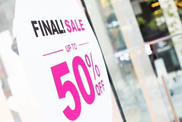 sign of sale on wall in modern shopping mall Modern Retail Sale SIgn