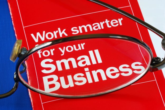 Focus on banking with Small Business isolated on blue Signage Tips for small businesses by Bartush Signs