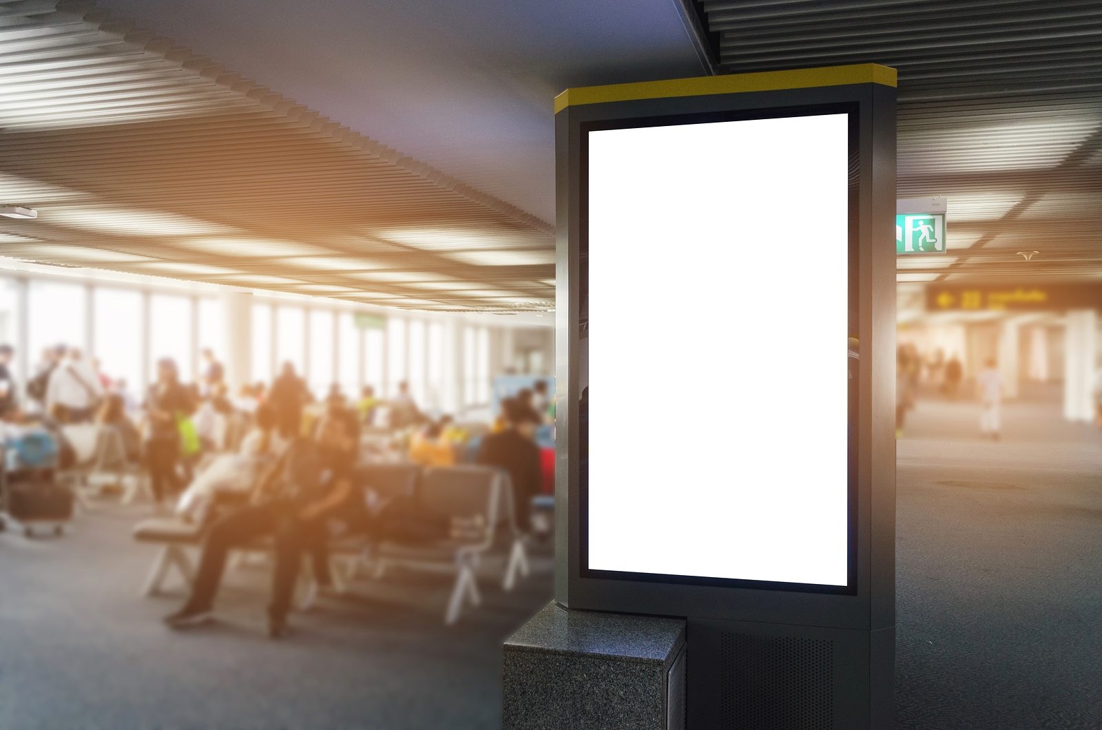 BartushSigns-April18–DigitalDisplay-1600×1059 vertical blank digital sign or light box showcase with people waiting at airport, copy space for your text message or media content, advertisement, commercial and marketing concept