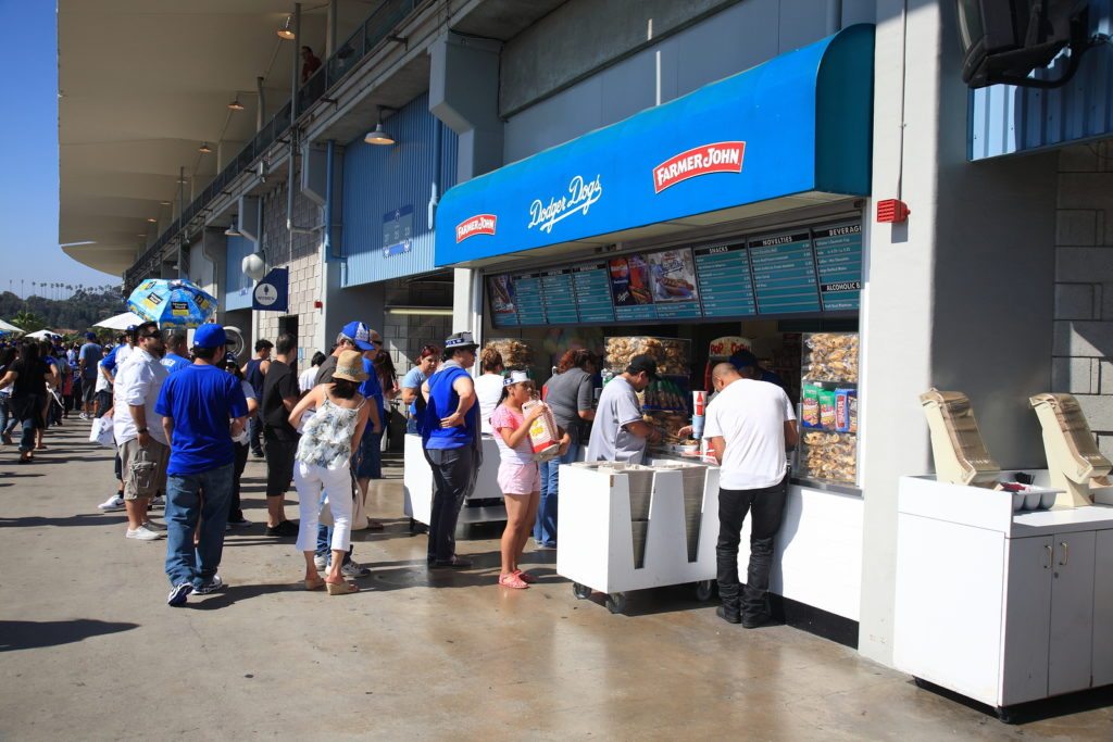 LOS ANGELES - JULY 1: Fans enjoy concessions at Dodger Stadium during a sunny day baseball game on July 1, 2012 in Los Angeles, California. Dodger Stadium opened in 1962 and cost $23 million.