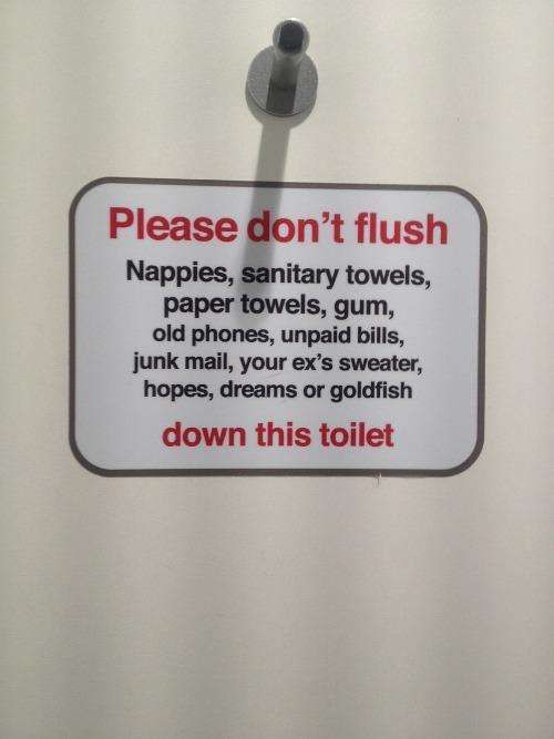 Sign about what not to flush in a toilet