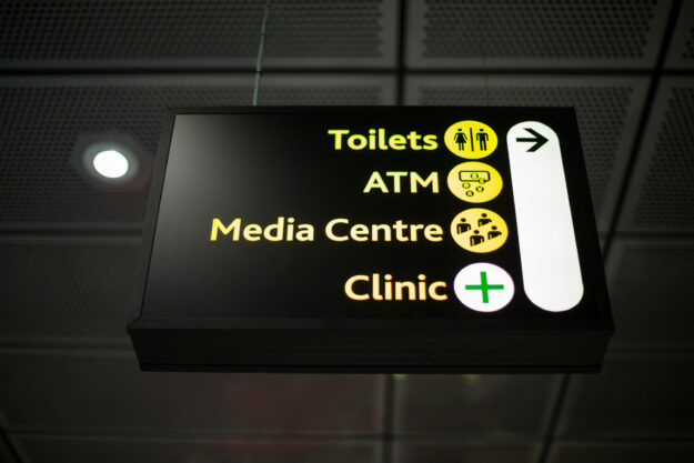 Close-up of information board at airport