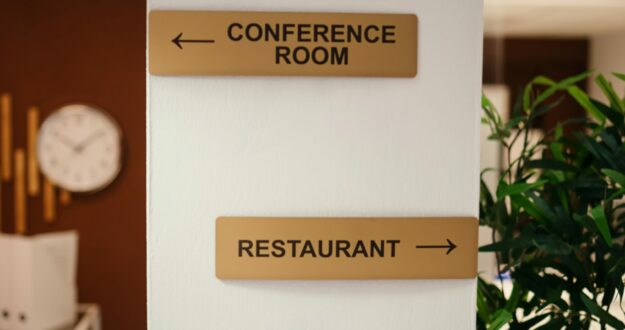 Close up shot of hotel facilities signs