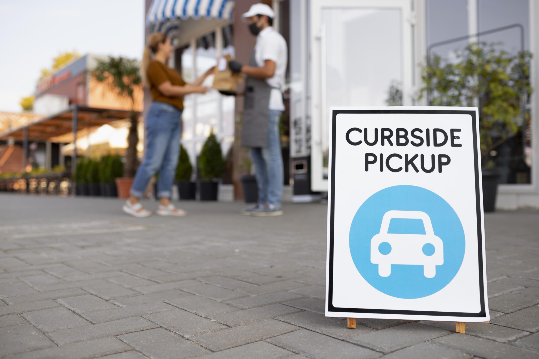 man-giving-order-curbside-pickup
